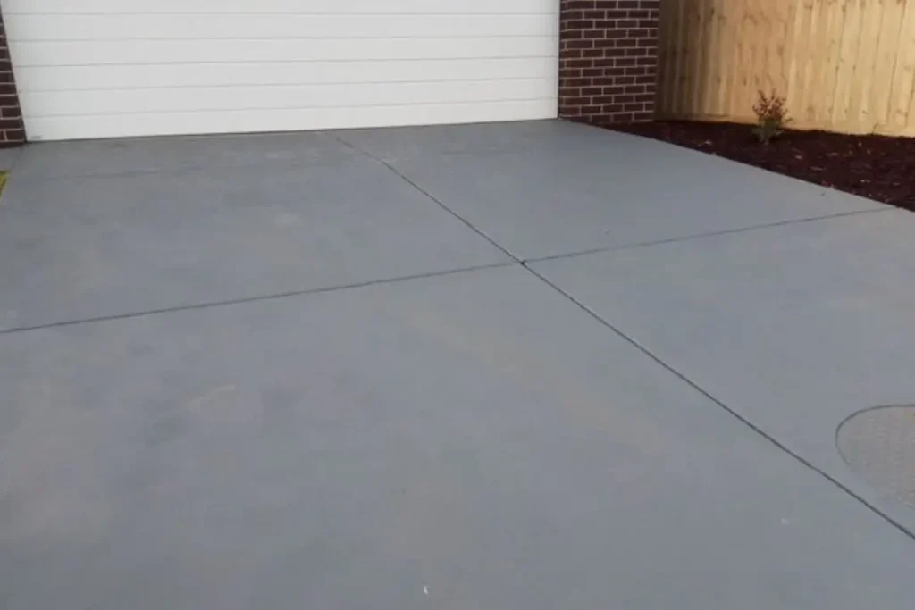 concrete driveway leading to garage