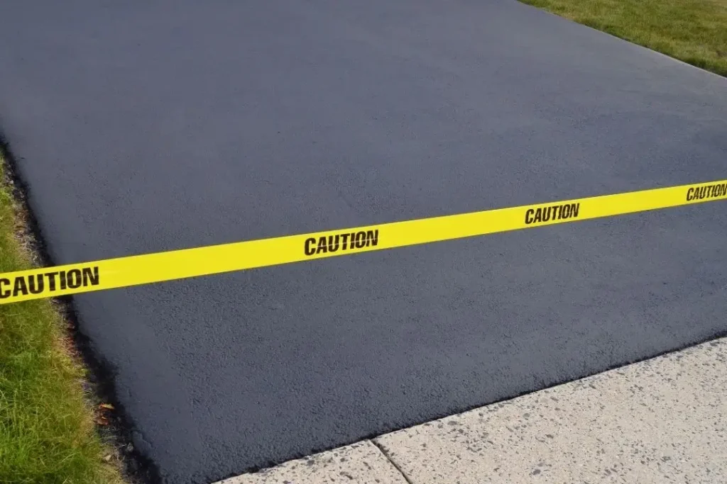 dark coloured concrete driveway