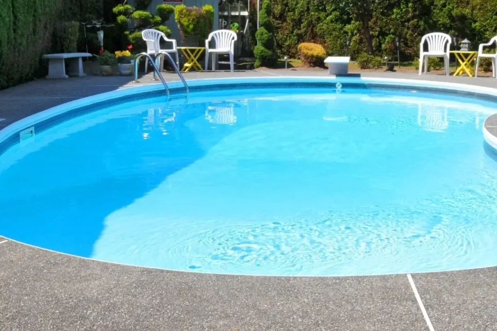 dark coloured concrete pool surround